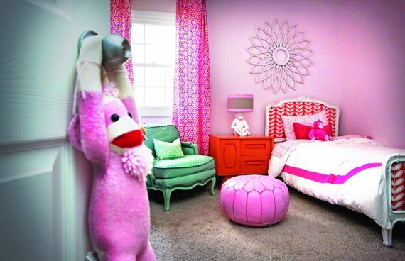 kids bedroom pink wall with a sock monkey