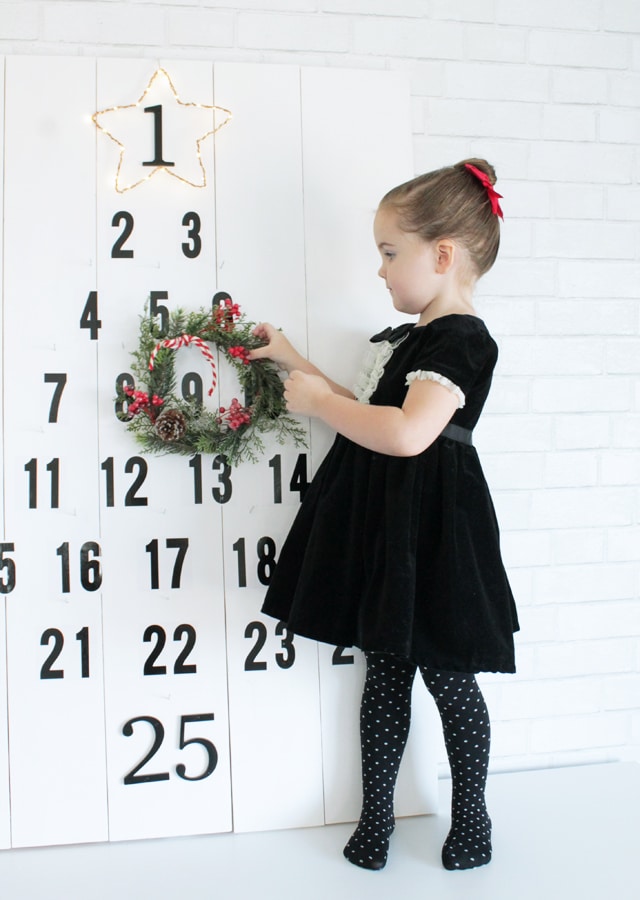 hanging-the-wreath-on-advent-tree