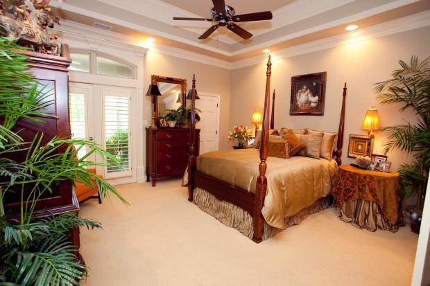 Traditional Bedroom with gold custom bed linens