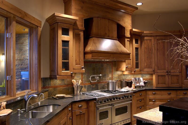 Rustic Kitchen Design with Pro Viking Range, Large Wood Hood, and Slate Tile Backsplash