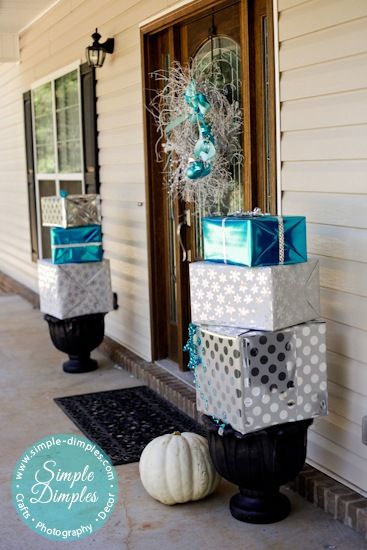 Branch Wreath and Wrapped Boxes on Planters. 