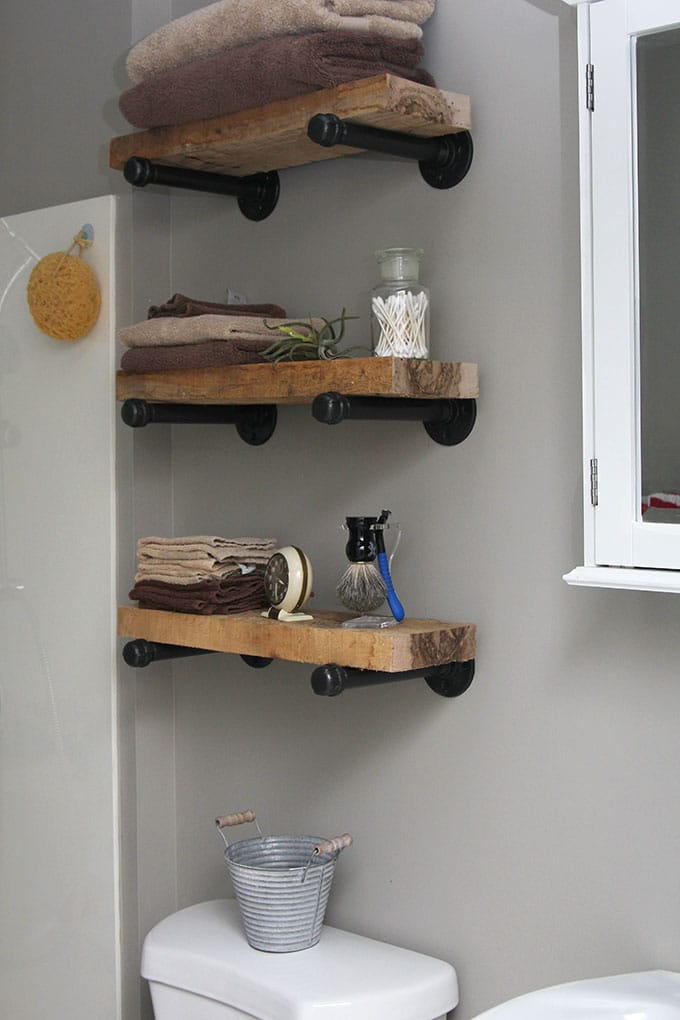 Super easy step by step tutorial for how to make DIY industrial pipe shelves at a fraction of the cost of the store bought version. These would look great with both farmhouse and industrial home decor!
