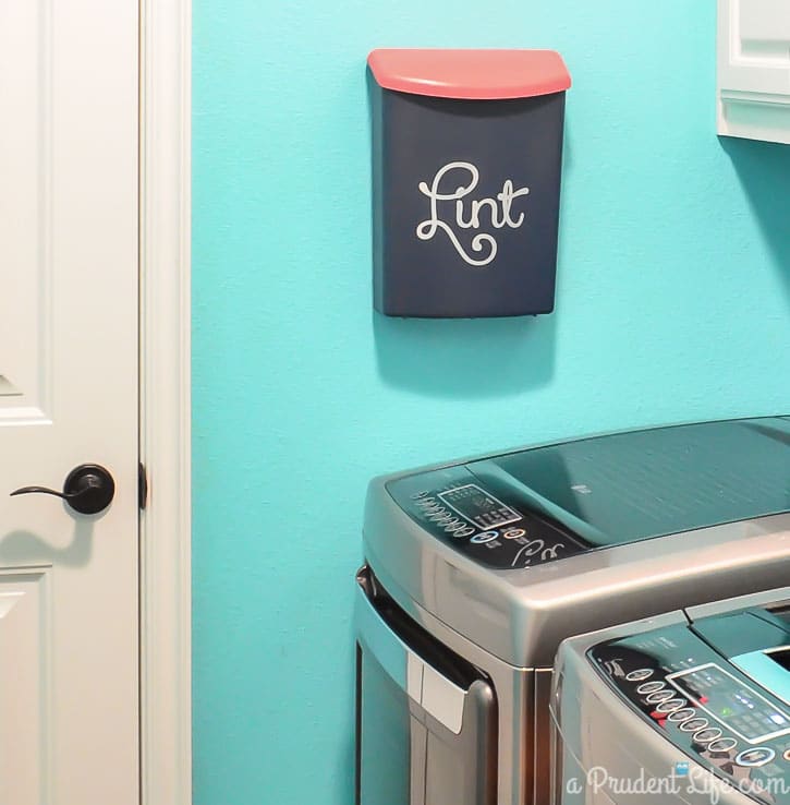 This is a great idea - make a wall mounted lint bin next to the dryer! 