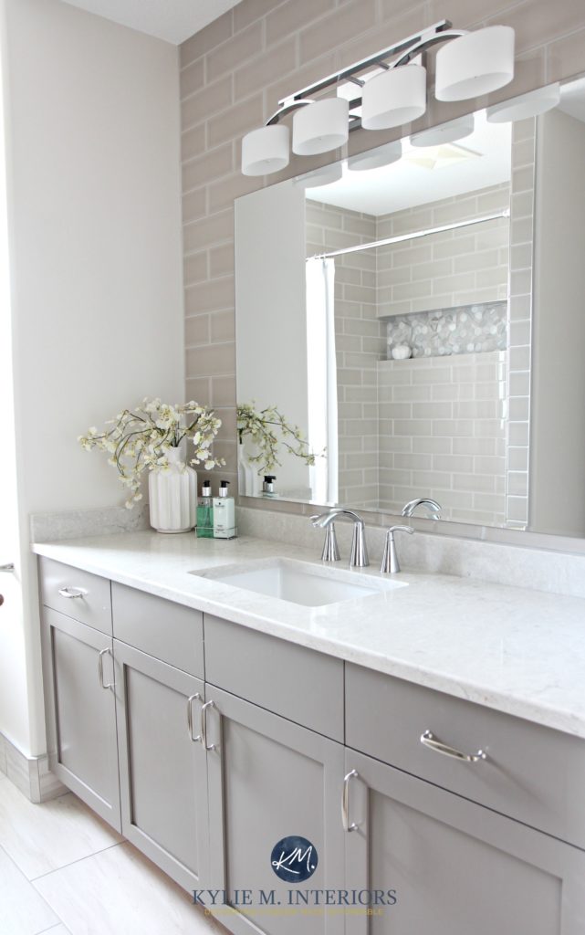 Bathroom remodel, Moen Glyde fixtures, Bianco Drift quartz countertop Caesarstone, subway tile wall, Gray painted vanity by Kylie M Interiors