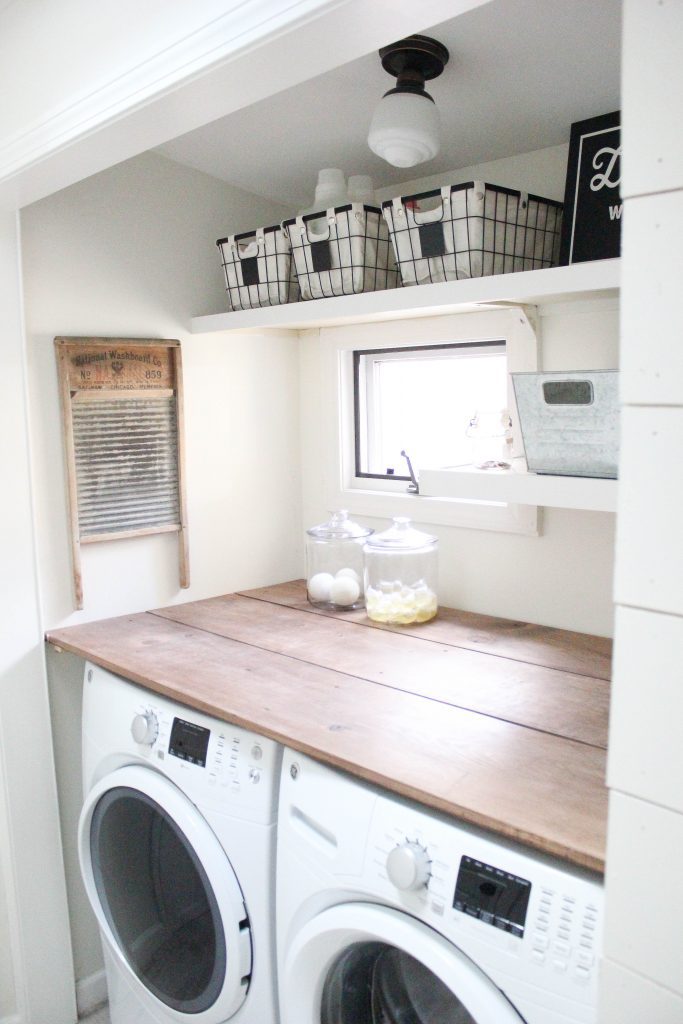 A budget-friendly farmhouse laundry room that's small, yet makes a large impact. The space is not only pretty, but functional for your laundry needs!