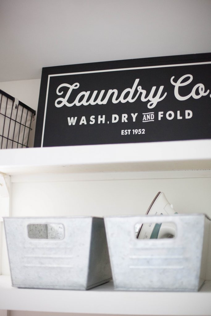 A budget-friendly farmhouse laundry room that's small, yet makes a large impact. The space is not only pretty, but functional for your laundry needs!