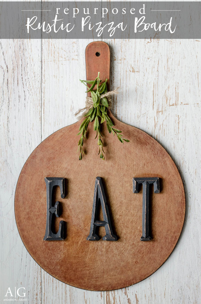 A beat up pizza board is repurposed into a piece of decor for a rustic kitchen. || www.andersonandgrant.com