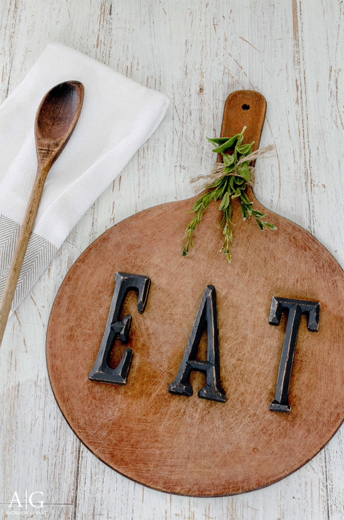 Learn how to make this rustic kitchen decor for your home using a repurposed cutting board. | www.andersonandgrant.com